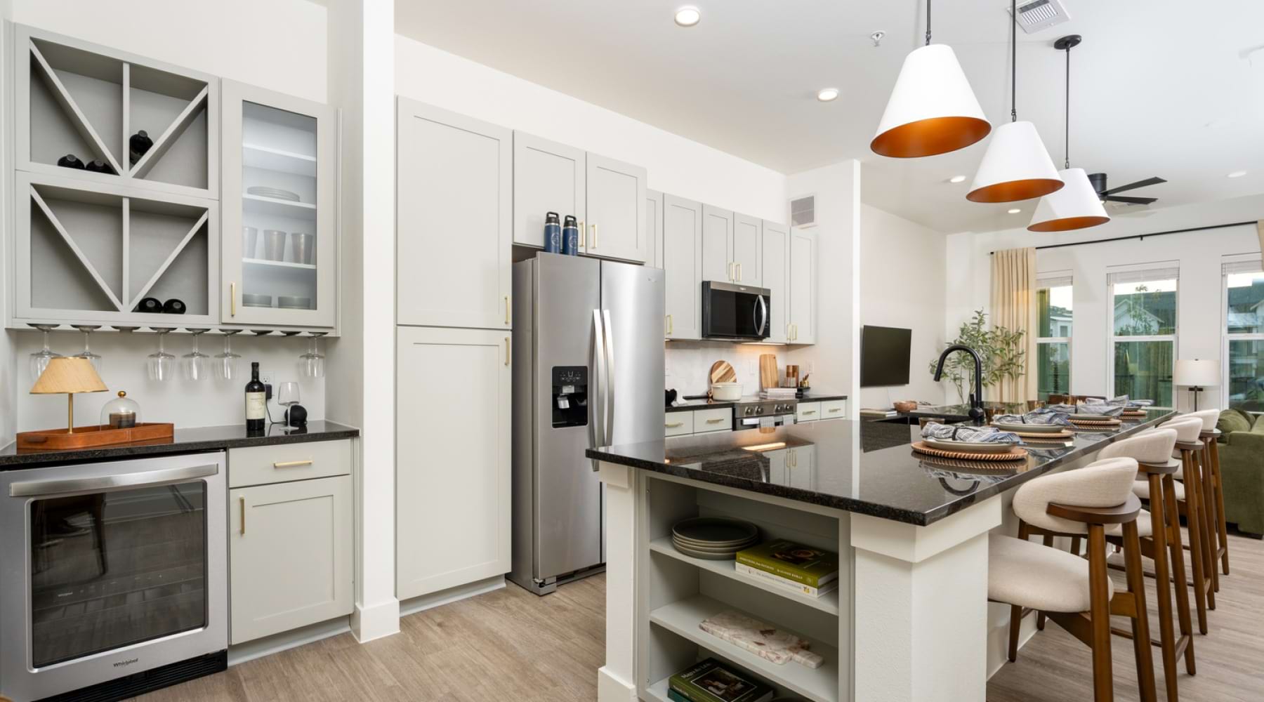 Kitchen with island, wine bar, fridge and seating