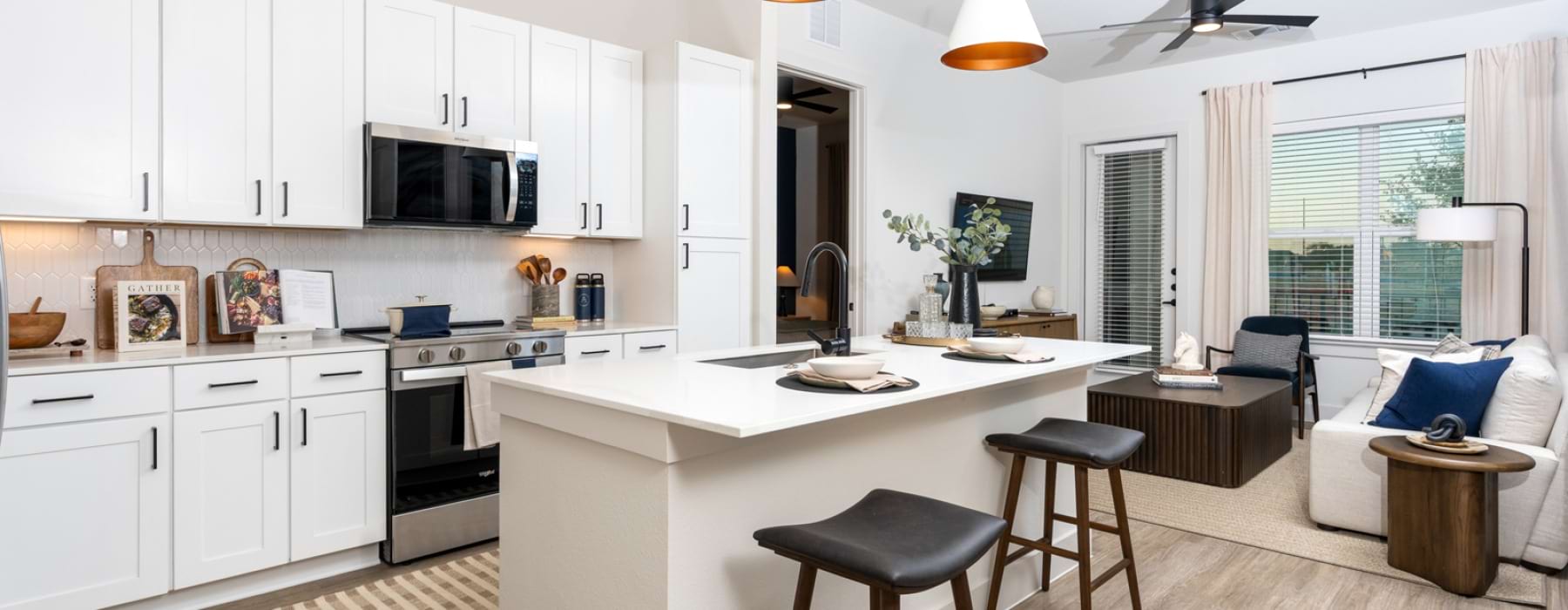 a kitchen with white cabinets